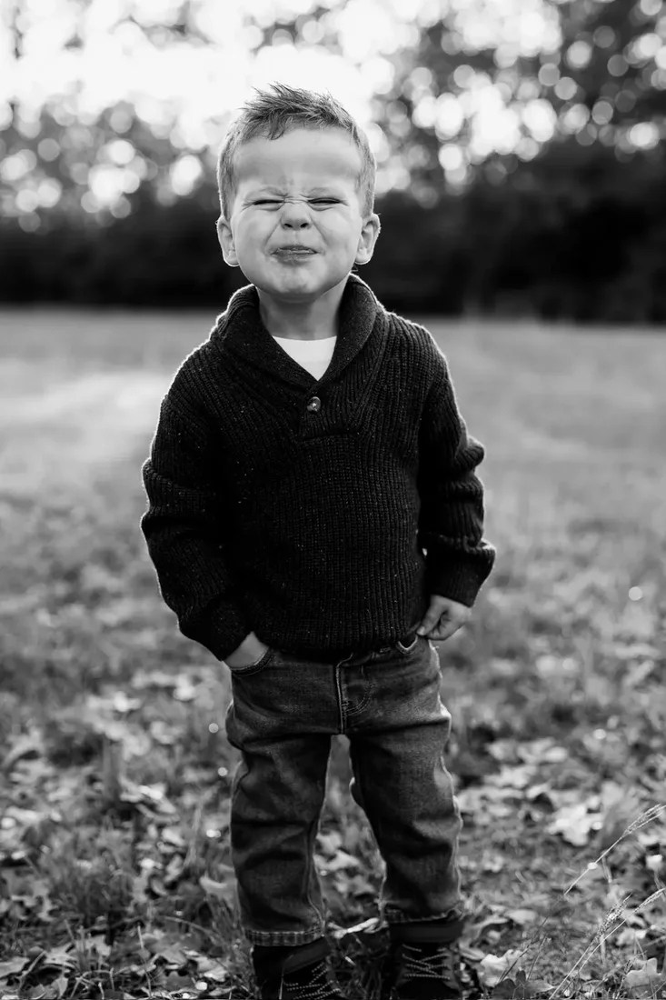 Little boy making a funny face, black and white