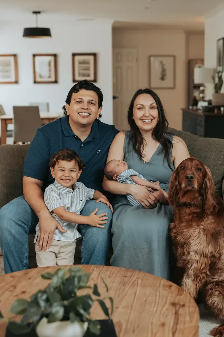 Family of four with their dog on the couch
