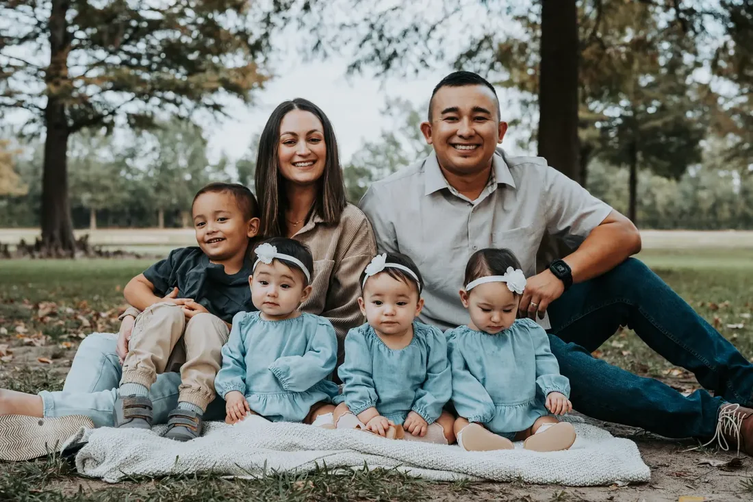 Family of six posed together outdoors